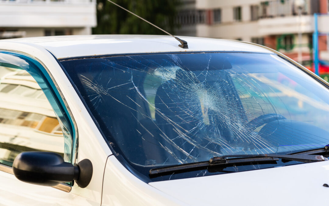 Broken car windshield, car involved in an accident
