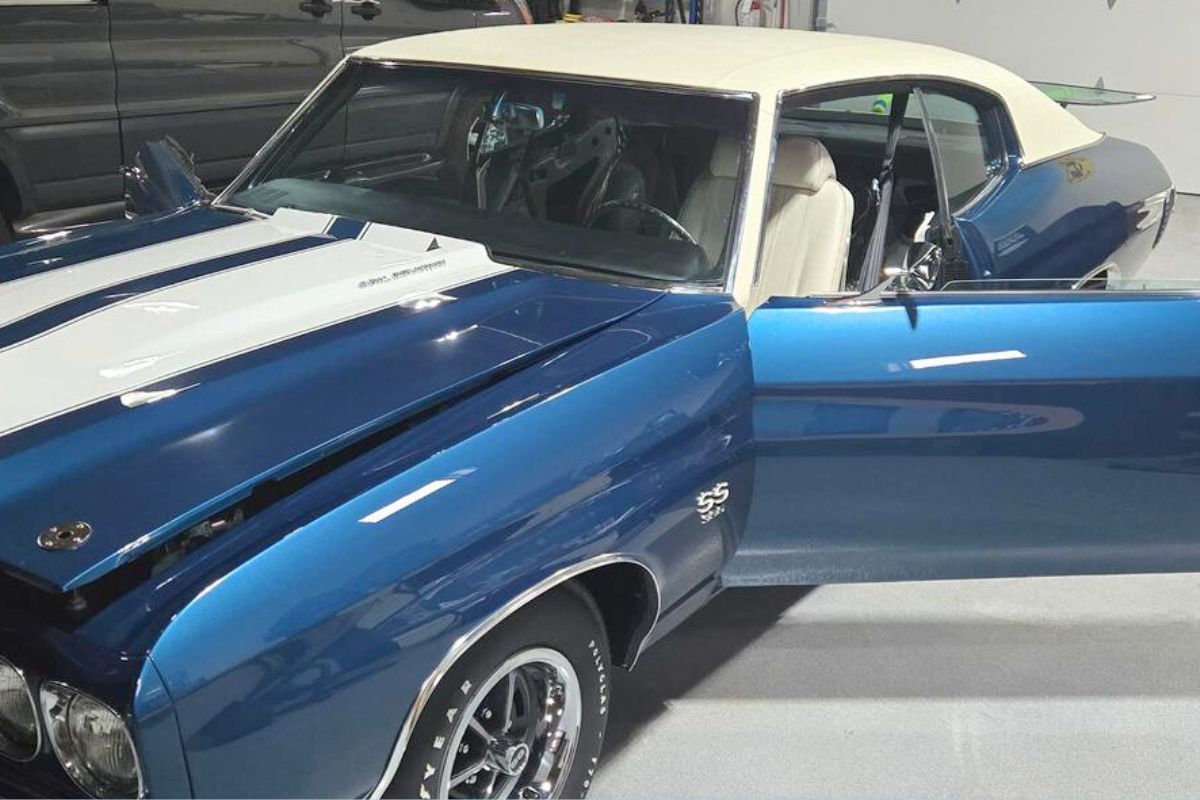 Specialty Custom Affordable Auto Glass Classic blue and white muscle car with open driver-side door and newly installed custom windshield, highlighting specialty auto glass services for classic cars near Nashotah, WI.