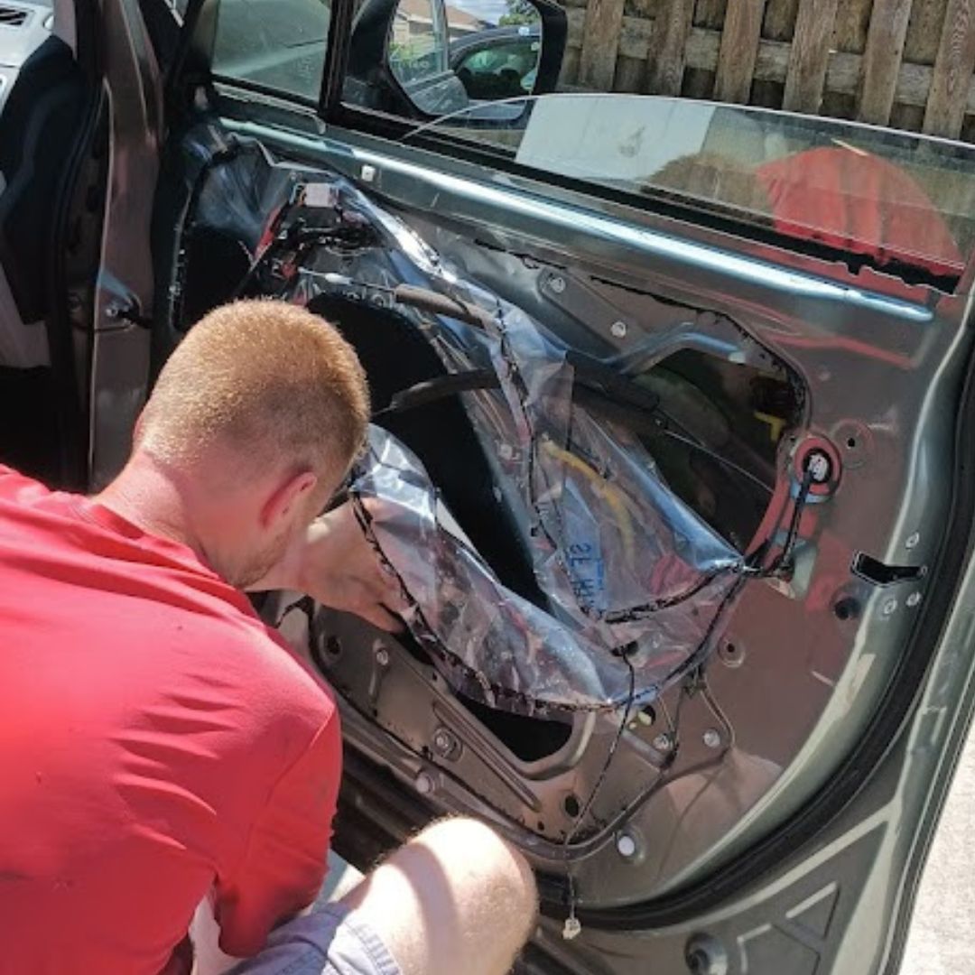 our expert technician replacing a door glass window