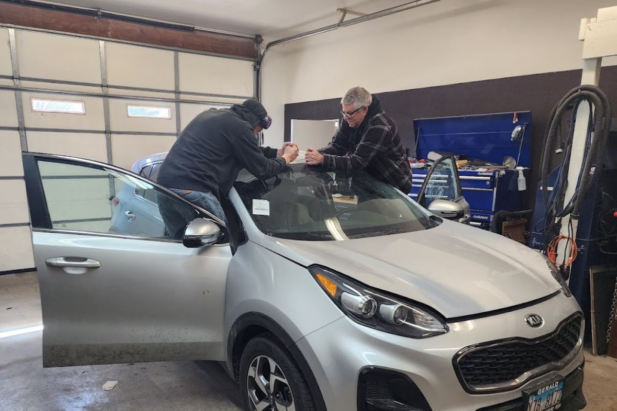 affordable-windshield-repair-milwaukee Technician repairing a cracked windshield in Milwaukee using mobile auto glass tools from Affordable Auto Glass