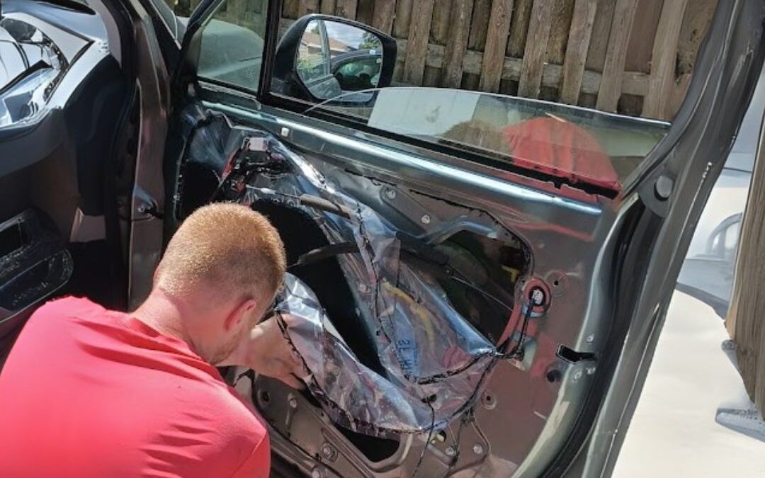 our expert technician at Affordable Auto Glass Wisconsin replacing a power window motor and car window glass