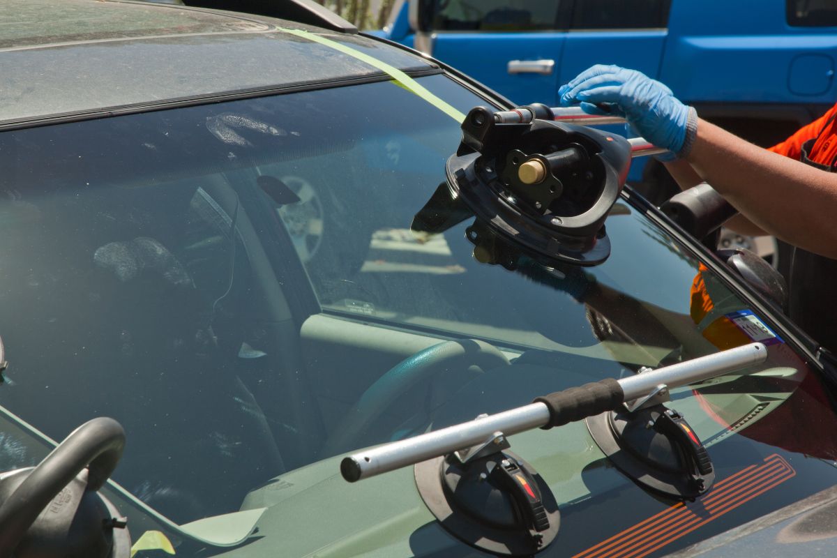 Wisconsin seasonal weather showing snowy road and summer sun—used to illustrate best timing for windshield replacement.