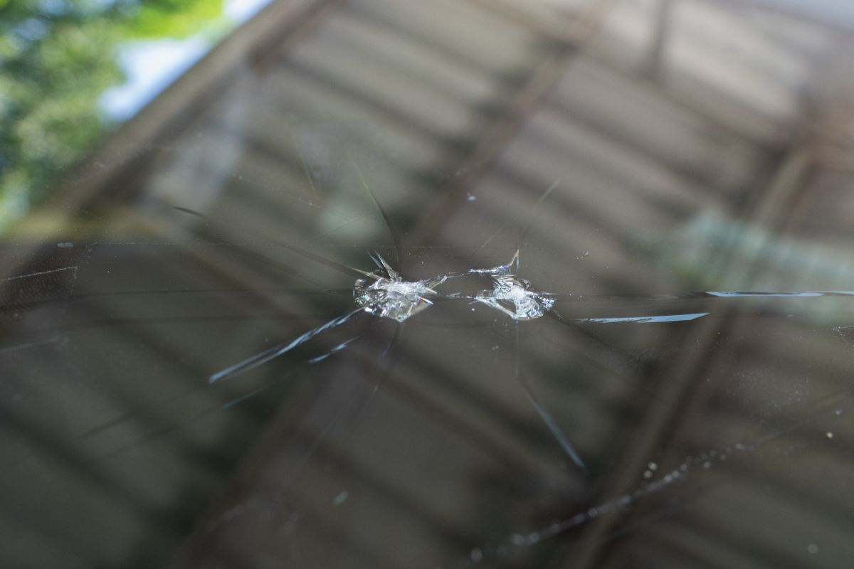 Close-up of a cracked windshield in Milwaukee, Wisconsin, representing insurance-covered auto glass repair.