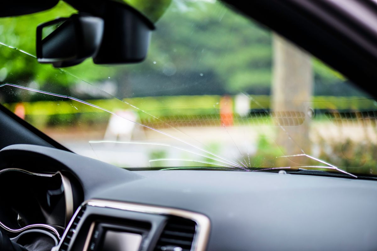 Cracked windshield inside a car showing rock chip damage needing auto glass repair in Wisconsin