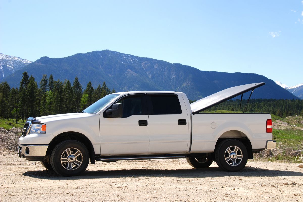Work pickup truck parked on a job site, representing vehicles that often need windshield replacement due to road debris and heavy use in Wisconsin.